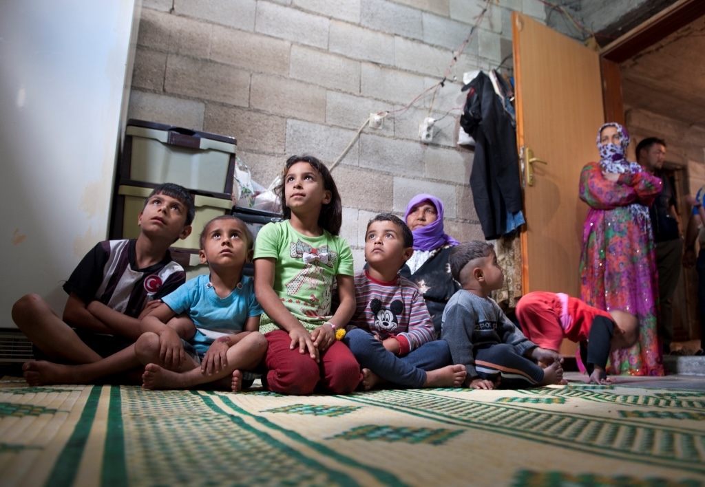 Sahla and her grandchıldren share their small flat wıth a refugee family fleeing the conflict in Syrıa. The EU/WFP helps them to buy food for the chıldren, but they still need aid such as clothıng. They want to go to Canada but face numerous challenges hindering their continued journey. Refugee families such as these become targets for human trafficking exploitation and abuse. Photo Credit: EU/ECHO/Abdurrahman Antakyali.