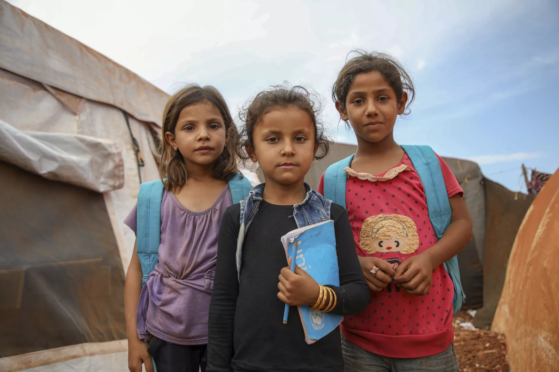 UNICEF supporting children in a refugee camp by promoting education. (Photo Credit: UNICEF)