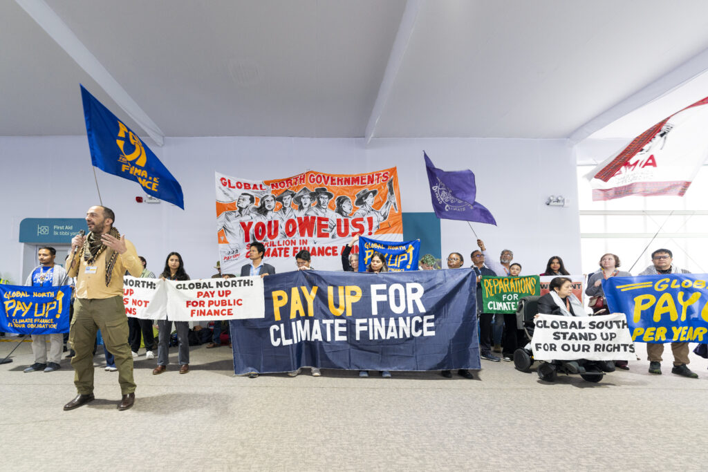 COP29 attendees voice demands for urgent and immediate action by major polluters. (Photo Credit: UN Climate Change)